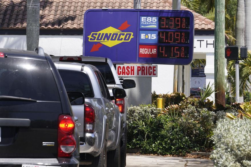 FILE - Cars line up at a Sunoco gas station offering high-level ethanol-gasoline blends at a cost below regular gasoline, on April 13, 2022, in Delray Beach, Fla. Just as Americans gear up for summer road trips, the price of oil remains stubbornly high, pushing prices at the gas pump to painful heights. AAA said Tuesday, May 10, 2022, drivers are paying $4.37 for a gallon of regular gasoline. (AP Photo/Marta Lavandier, File)