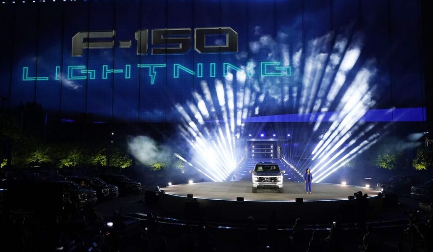 Ford's Chief Executive Engineer Linda Zhang unveils the Ford F-150 Lightning, Wednesday, May 19, 2021, in Dearborn, Mich. United Rental said Tuesday, May 10, it has a deal to buy 500 of Ford’s F-150 Lightning electric trucks and 30 of its E-Transit electric vans. United Rental expects 120 of the trucks and all 30 of the vans to be delivered and deployed this year as part of its goal to reduce its fleet’s greenhouse gas emissions. (AP Photo/Carlos Osorio, File )