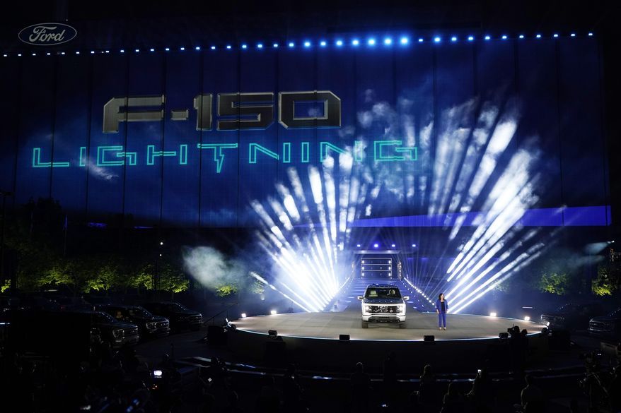 Ford's Chief Executive Engineer Linda Zhang unveils the Ford F-150 Lightning, Wednesday, May 19, 2021, in Dearborn, Mich. United Rental said Tuesday, May 10, it has a deal to buy 500 of Ford’s F-150 Lightning electric trucks and 30 of its E-Transit electric vans. United Rental expects 120 of the trucks and all 30 of the vans to be delivered and deployed this year as part of its goal to reduce its fleet’s greenhouse gas emissions. (AP Photo/Carlos Osorio, File )