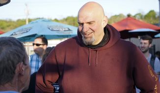 Pennsylvania Lt. Gov. John Fetterman, who is running for the Democratic nomination for the U.S. Senate for Pennsylvania, greets supporters at a campaign stop, Tuesday, May 10, 2022, in Greensburg, Pa. (AP Photo/Keith Srakocic)