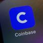 The mobile phone icon for the Coinbase app is shown in this photo, in New York, Tuesday, April 13, 2021. Cryptocurrency trading platform Coinbase has lost half its value in the past week, including its biggest one-day drop ever on Wednesday, May 11, 2022,  as the famously volatile crypto market weathers yet another slump.   (AP Photo/Richard Drew, File)