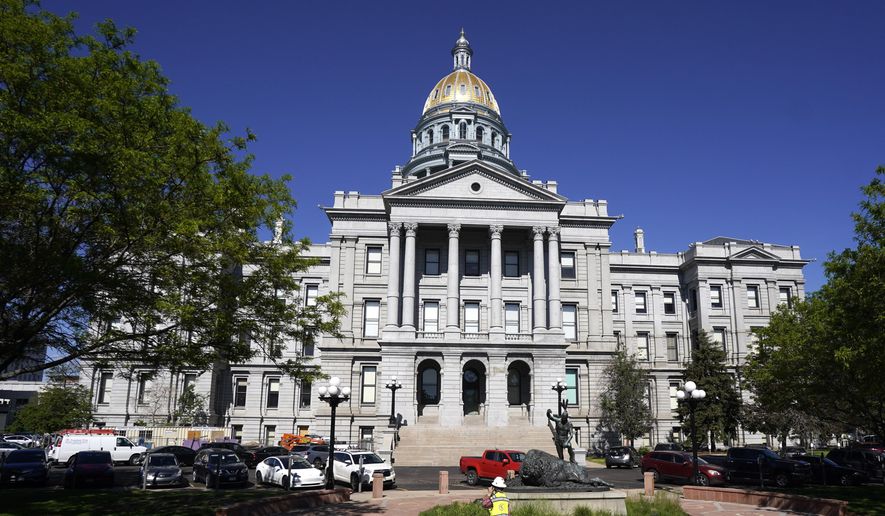 In this May 28, 2021, photo, the morning sun shines on the State Capitol in downtown Denver. (AP Photo/David Zalubowski, File)