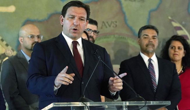 Florida Gov. Ron DeSantis speaks at Miami&#x27;s Freedom Tower, on Monday, May 9, 2022, in Miami. A congressional map approved by DeSantis and drawn by his staff is unconstitutional because it breaks up a district where Black voters can choose their representatives, a state judge said Wednesday, May 11, 2022. (AP Photo/Marta Lavandier, File)