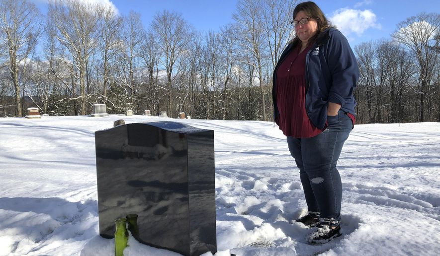 Deb Walker visits the grave of her daughter, Brooke Goodwin, Thursday, Dec. 9, 2021, in Chester, Vt. Goodwin, 23, died in March of 2021 of a fatal overdose of the powerful opioid fentanyl and xylazine, an animal tranquilizer that is making its way into the illicit drug supply. According to provisional data released by the Centers for Disease Control and Prevention on Wednesday, May 11, 2022, more than 107,000 Americans died of drug overdoses in 2021, setting another tragic record in the nation’s escalating overdose epidemic. (AP Photo/Lisa Rathke) **FILE**