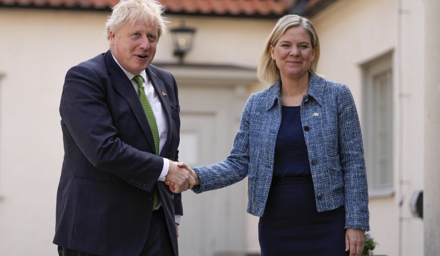 British Prime Minister Boris Johnson, left, is welcomed by Sweden&#39;s Prime Minister Magdalena Andersson in Harpsund, the country retreat of Swedish prime ministers, Wednesday, May 11, 2022. Johnson is visiting Sweden and Finland ahead of their decision on whether to apply for NATO membership. (AP Photo/Frank Augstein, Pool)