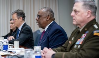 Secretary of Defense Lloyd Austin, accompanied by Chairman of the Joint Chiefs of Staff Gen. Mark Milley, right, speaks during a meeting with Jordan&#39;s King Abdullah II bin Al-Hussein and Crown Prince of Jordan Hussein bin Abdullah at the Pentagon in Washington, Thursday, May 12, 2022. (AP Photo/Andrew Harnik)