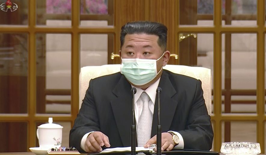 In this image made from video broadcasted by North Korea&#39;s KRT, North Korean leader Kim Jong Un wears a face mask on state television during a meeting acknowledging the country&#39;s first case of COVID-19 Thursday, May 12, 2022, in Pyongyang, North Korea. North Korea imposed a nationwide lockdown Thursday to control its first acknowledged COVID-19 outbreak after holding for more than two years to a widely doubted claim of a perfect record keeping out the virus that has spread to nearly every place in the world. (KRT via AP)