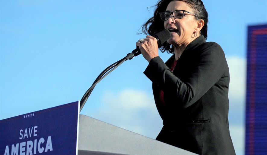 Former South Carolina state lawmaker Katie Arrington speaks at a rally ahead of an appearance by former President Donald Trump on Saturday, March 12, 2022, in Florence, S.C. Arrington — now making a second congressional bid — says a dispute over her access to top-secret government information has been part of a politically motivated smear campaign tied to her support of former President Donald Trump. (AP Photo/Meg Kinnard)
