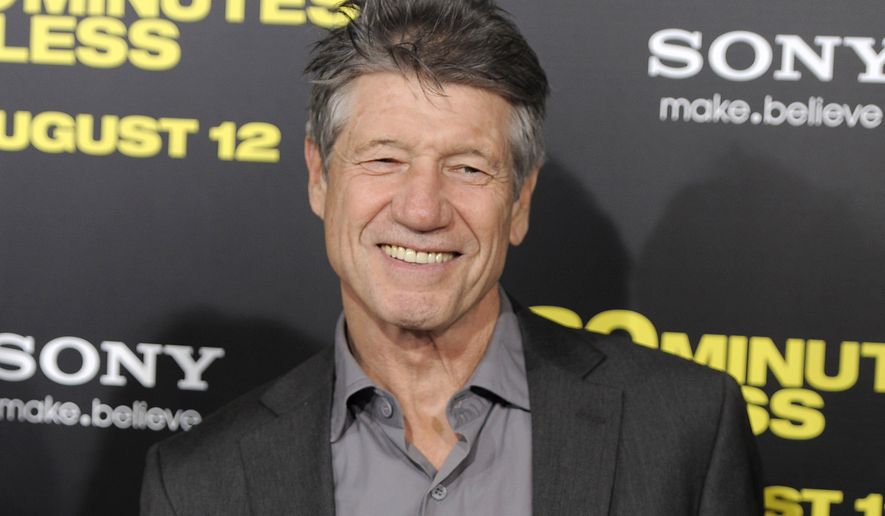 FILE - Fred Ward, a cast member in &quot;30 Minutes or Less,&quot; poses at the premiere of the film in Los Angeles on Aug. 8, 2011. Ward, a veteran actor who brought a gruff tenderness to tough-guy roles in such films as “The Right Stuff,” “The Player” and “Tremors,” died Sunday, May 8, his publicist Ron Hofmann said Friday, May 13, 2022. He was 79. (AP Photo/Chris Pizzello, File)