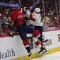 Washington Capitals left wing Marcus Johansson, left, and Florida Panthers defenseman Ben Chiarot collide along the boards during the first period of Game 6 in the first round of the NHL Stanley Cup hockey playoffs, Friday, May 13, 2022, in Washington. (AP Photo/Alex Brandon)