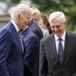 President Joe Biden walks back to the Oval Office past Attorney General Merrick Garland after speaking in the Rose Garden of the White House in Washington, Friday, May 13, 2022, during an event to highlight state and local leaders who are investing American Rescue Plan funding. (AP Photo/Andrew Harnik)