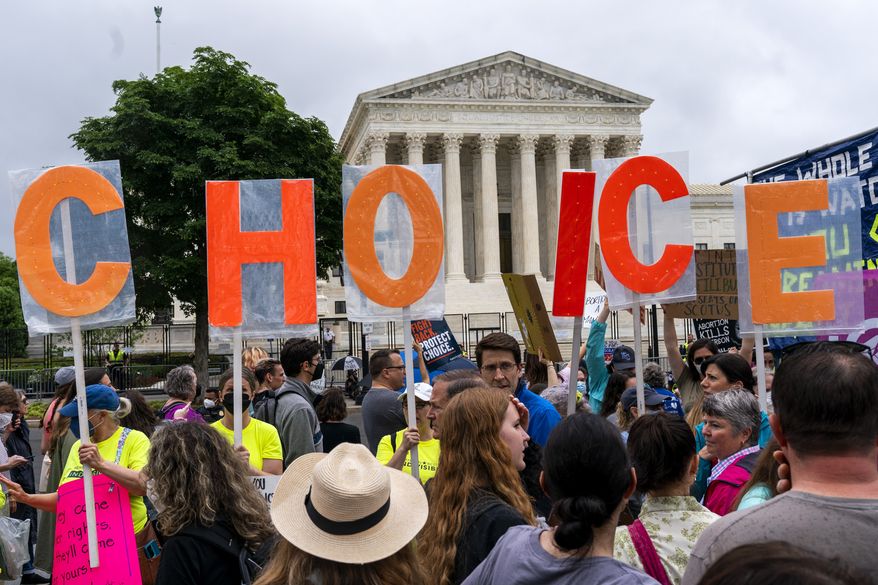 Abortion-rights demonstrators hold up letters spelling out &quot;My Choice,&quot; Saturday, May 14, 2022, outside the Supreme Court in Washington. (AP Photo/Jacquelyn Martin)
