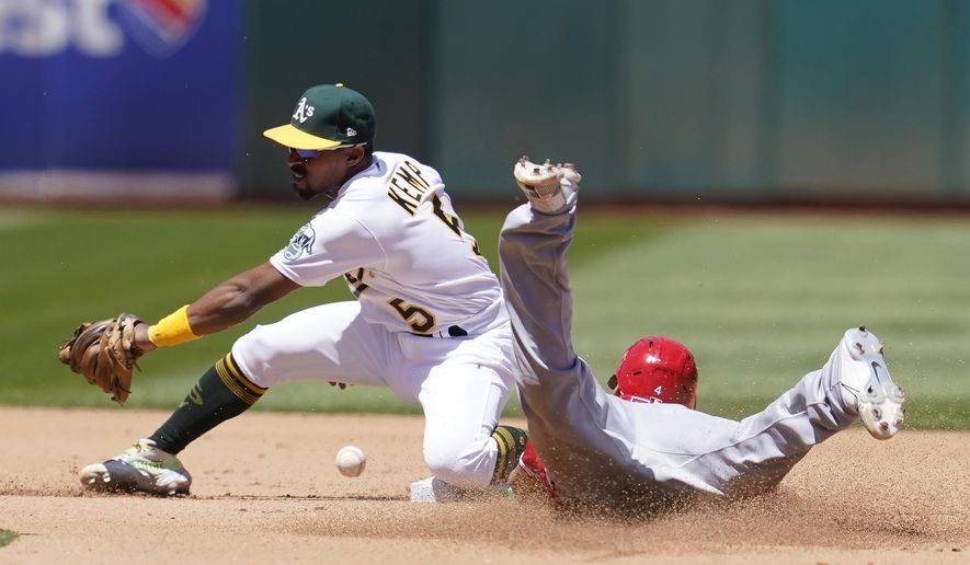 Los Angeles Angels&#39; Andrew Velazquez, right, steals second base against Oakland Athletics second baseman Tony Kemp during the fourth inning of the first baseball game of a doubleheader in Oakland, Calif., Saturday, May 14, 2022. (AP Photo/Jeff Chiu)