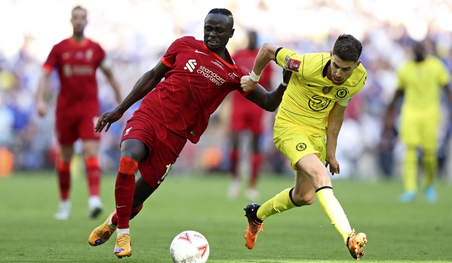 Chelsea&#39;s Jorginho, right, fights for the ball with Liverpool&#39;s Sadio Mane during the English FA Cup final soccer match between Chelsea and Liverpool, at Wembley stadium, in London, Saturday, May 14, 2022. (AP Photo/Ian Walton)
