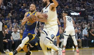 Golden State Warriors guard Stephen Curry drives to the basket against Memphis Grizzlies center Steven Adams during the first half of Game 6 of an NBA basketball Western Conference playoff semifinal in San Francisco, Friday, May 13, 2022. (AP Photo/Tony Avelar)