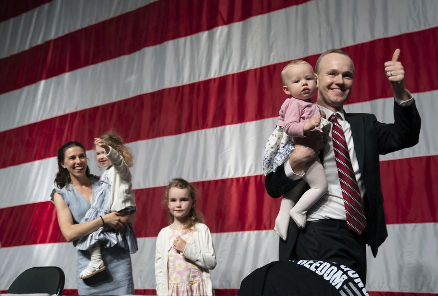 GOP attorney general candidate Jim Schultz leaves the stage with his wife Molly and their children during the first day of the Minnesota State Republican Convention, Friday, May 13, 2022,  at the Mayo Civic Center in. Rochester, Minn. (Glen Stubbe/Star Tribune via AP)