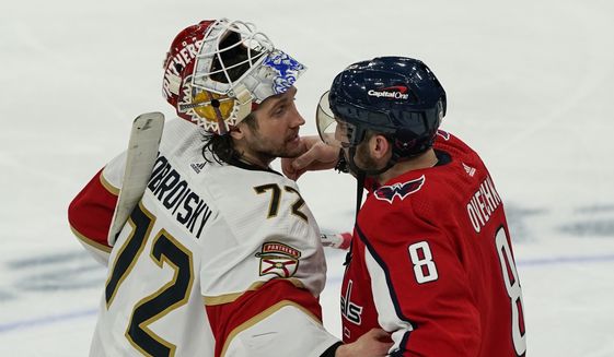 Florida Panthers goaltender Sergei Bobrovsky (72) and Washington Capitals left wing Alex Ovechkin (8) react after Game 6 in the first round of the NHL Stanley Cup hockey playoffs, Friday, May 13, 2022, in Washington. (AP Photo/Alex Brandon)