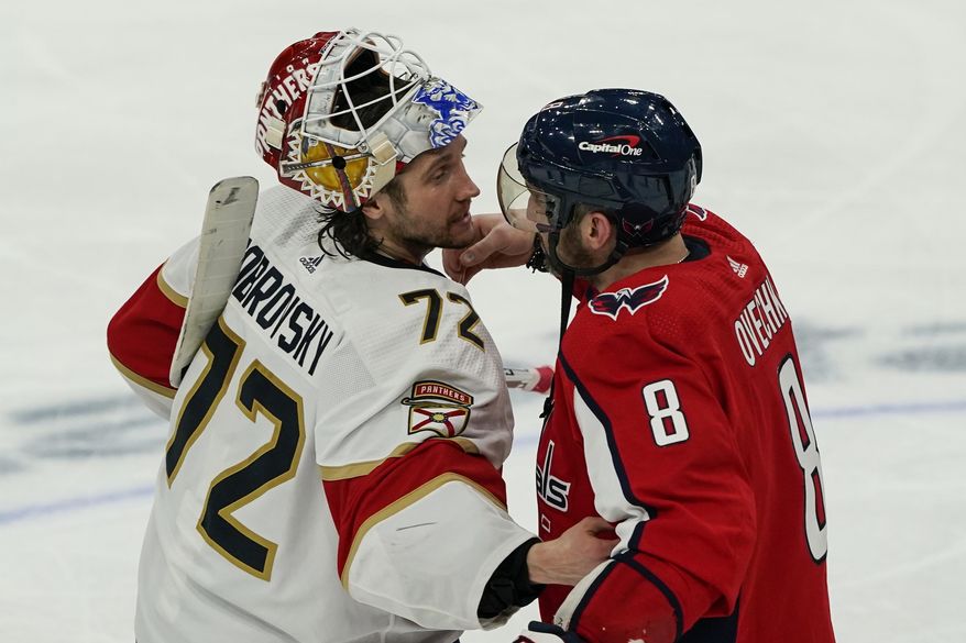 Florida Panthers goaltender Sergei Bobrovsky (72) and Washington Capitals left wing Alex Ovechkin (8) react after Game 6 in the first round of the NHL Stanley Cup hockey playoffs, Friday, May 13, 2022, in Washington. (AP Photo/Alex Brandon)
