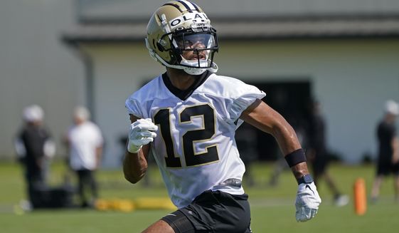New Orleans Saints wide receiver Chris Olave (12) works out during the NFL football team&#39;s rookie minicamp in Metairie, La., Saturday, May 14, 2022. (AP Photo/Gerald Herbert)