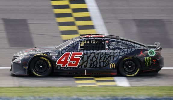 Kurt Busch (45) crosses the finish line to win a NASCAR Cup Series auto race at Kansas Speedway in Kansas City, Kan., Sunday, May 15, 2022. (AP Photo/Colin E. Braley)