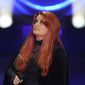 Wynonna Judd looks up after singing during a tribute to her mother, country music star Naomi Judd, Sunday, May 15, 2022, in Nashville, Tenn. Naomi Judd died April 30. She was 76. (AP Photo/Mark Humphrey)