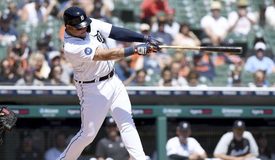 Detroit Tigers designated hitter Miguel Cabrera hits a sacrifice fly to score teammate Javier Baez from third base in the third inning of a baseball game against the Baltimore Orioles in Detroit, Sunday, May 15, 2022. (AP Photo/Lon Horwedel)
