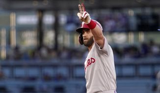 Philadelphia Phillies&#39; Bryce Harper gestures toward his dugout after hitting a double during the first inning of a baseball game against the Los Angeles Dodgers Saturday, May 14, 2022, in Los Angeles. (AP Photo/Mark J. Terrill) **FILE**
