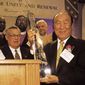 The Reverand Sun Myung Moon accepts an award from a special committee of clergy after he addressed The Inaugural Prayer Luncheon for Unity and Renewal at The Hyatt regency Hotel in Washington, DC, January 19, 2001. ( J.M. Eddins Jr. / The Washington Times )
