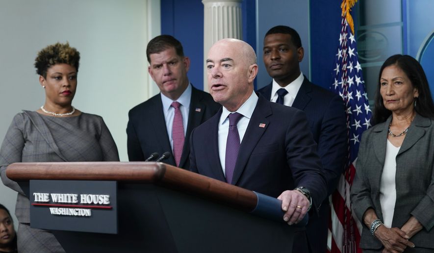 Homeland Security Secretary Alejandro Mayorkas, center, speaks during a briefing at the White House in Washington, Monday, May 16, 2022, on the six-month anniversary of the bipartisan infrastructure law. He is joined by, from left, Office of Management and Budget director Shalanda Young, Labor Secretary Marty Walsh, Environmental Protection Agency administrator Michael Regan, and Interior Secretary Deb Haaland. (AP Photo/Susan Walsh)