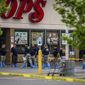 FBI Investigators enter the Tops supermarket in Buffalo, N.Y. on Monday, May 16 2022. (AP Photo/Robert Bumsted)