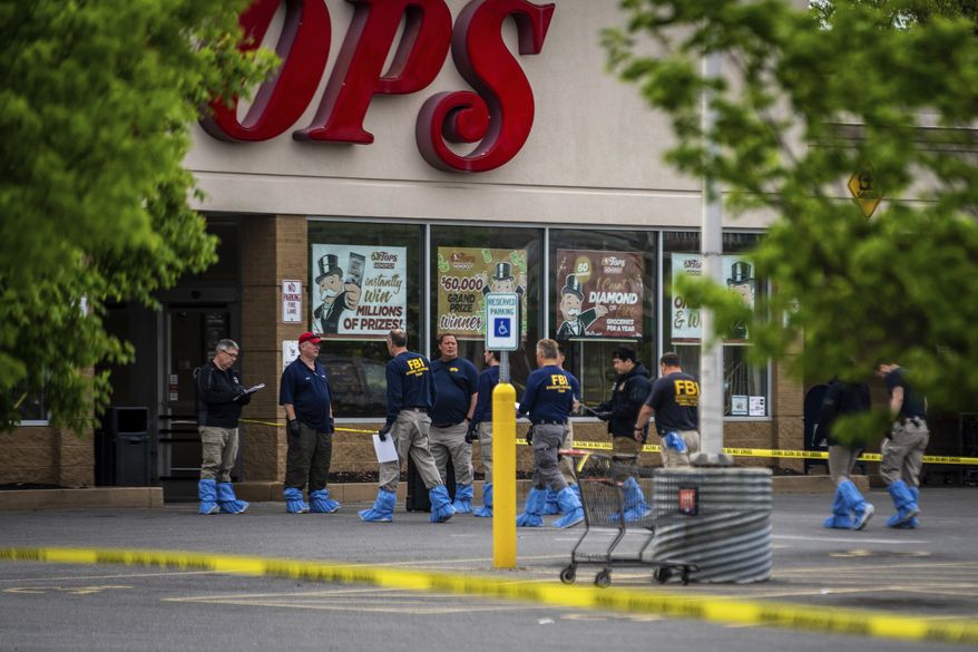 FBI Investigators enter the Tops supermarket in Buffalo, N.Y. on Monday, May 16 2022. (AP Photo/Robert Bumsted)