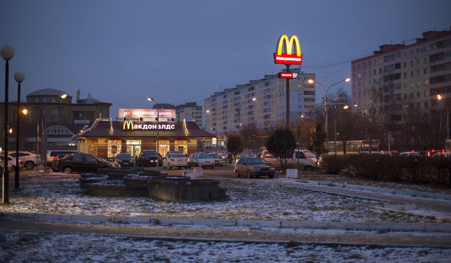 McDonald&#39;s restaurant is seen in the center of Dmitrov, a Russian town 75 km., (47 miles) north from Moscow, Russia, on Dec. 6, 2014. Mcdonald&#39;s says it&#39;s started the process of selling its Russian business, which includes 850 restaurants that employ 62,000 people. The fast-food giant pointed to the humanitarian crisis caused by the war, saying holding on to its business in Russia is no longer tenable, nor is it consistent with Mcdonald&#39;s values. The Chicago-based company had temporarily closed its stores in Russia but was still paying employees. (AP Photo/FILE)