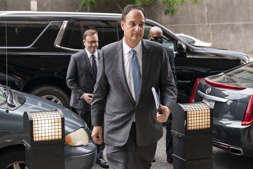 In this file photo, Michael Sussmann, a cybersecurity lawyer who represented the Hillary Clinton presidential campaign in 2016, arrives to the E. Barrett Prettyman Federal Courthouse, Monday, May 16, 2022, in Washington. Sussmann is accused of making a false statement to the FBI during the Trump-Russia probe. (AP Photo/Evan Vucci)  **FILE**