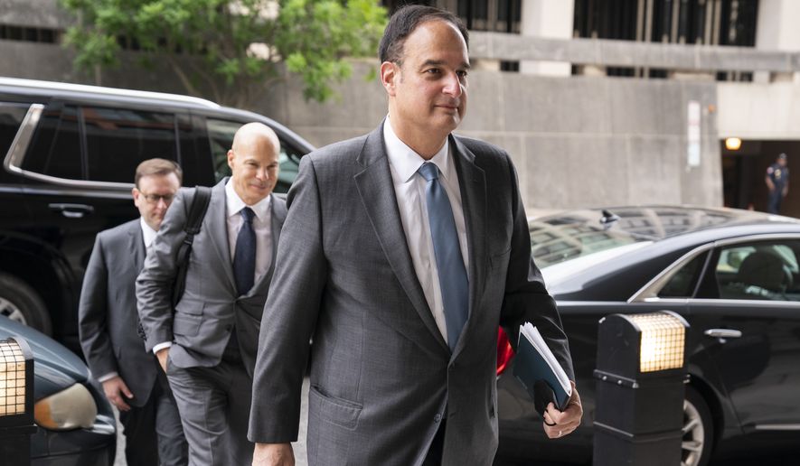 Michael Sussmann, a cybersecurity lawyer who represented the Hillary Clinton presidential campaign in 2016, arrives to the E. Barrett Prettyman Federal Courthouse, Monday, May 16, 2022, in Washington. Sussmann is accused of making a false statement to the FBI during the Trump-Russia probe. (AP Photo/Evan Vucci)