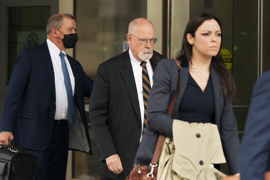 In this file photo, special counsel John Durham, center, the prosecutor appointed to investigate potential government wrongdoing in the early days of the Trump-Russia probe, leaves a federal courthouse in Washington, Monday, May 16, 2022. (AP Photo/Manuel Balce Ceneta)  **FILE**