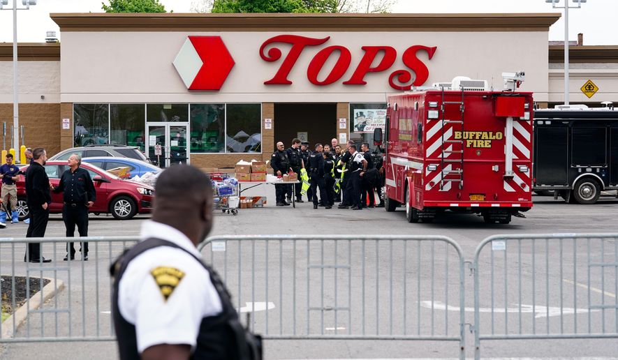 Investigators work the scene of a shooting at a supermarket, in Buffalo, N.Y., Monday, May 16, 2022. (AP Photo/Matt Rourke)