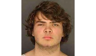 This image provided by the Erie County District Attorney&#39;s Office shows Payton Gendron.  While law enforcement officials have grown adept since the Sept. 11 attacks at disrupting well-organized plots, they face a much tougher challenge in intercepting self-radicalized young men who absorb racist screeds on social media and plot violence on their own.  (Erie County District Attorney&#39;s Office via AP)