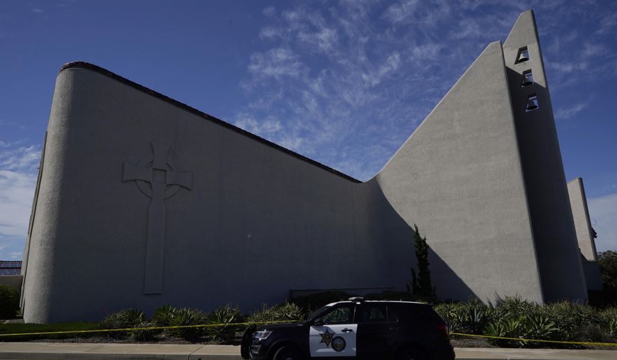A patrol vehicle is seen outside Geneva Presbyterian Church in Laguna Woods, Calif., Sunday, May 15, 2022, after a fatal shooting. (AP Photo/Damian Dovarganes)