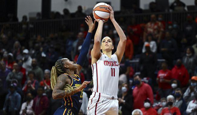 Washington Mystics forward Elena Delle Donne (11) shoots the ball against Indiana Fever guard Tiffany Mitchell (25) during the first half of an WNBA basketball game, Friday, May 6, 2022, in Washington. After two seasons in which she barely played, Washington Mystics star Elena Delle Donne is back -- and still looking like one of the WNBA&#x27;s top players. (AP Photo/Terrance Williams, File) **FILE**