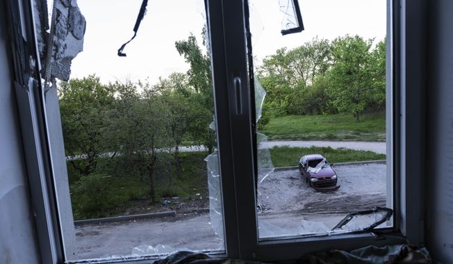 A building damaged by multiple shelling stands in Kharkiv, Ukraine, Sunday, May 15, 2022. (AP Photo/Bernat Armangue)