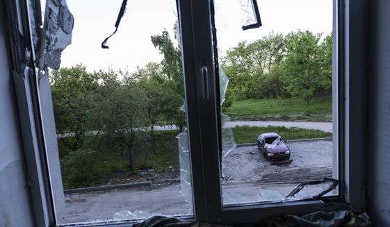 A building damaged by multiple shelling stands in Kharkiv, Ukraine, Sunday, May 15, 2022. (AP Photo/Bernat Armangue)