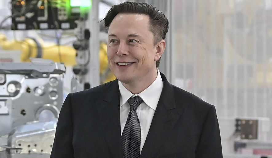Tesla CEO Elon Musk attends the opening of the Tesla factory Berlin Brandenburg in Gruenheide, Germany on March 22, 2022. Musk says his deal to buy Twitter can’t ‘move forward’ unless the company shows public proof that less than 5% of the accounts on the platform are fake or spam. Musk made the comment in a reply to another user on Twitter early Tuesday, May 17, 2022. (Patrick Pleul/Pool Photo via AP, File)
