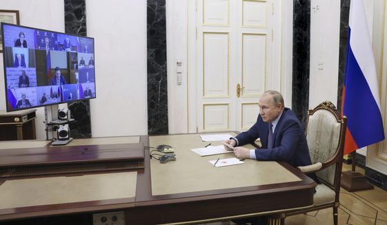 Russian President Vladimir Putin chairs a meeting on oil industry development via a video conference at the Kremlin in Moscow, Russia, Tuesday, May 17, 2022. (Mikhail Metzel, Sputnik, Kremlin Pool Photo via AP)