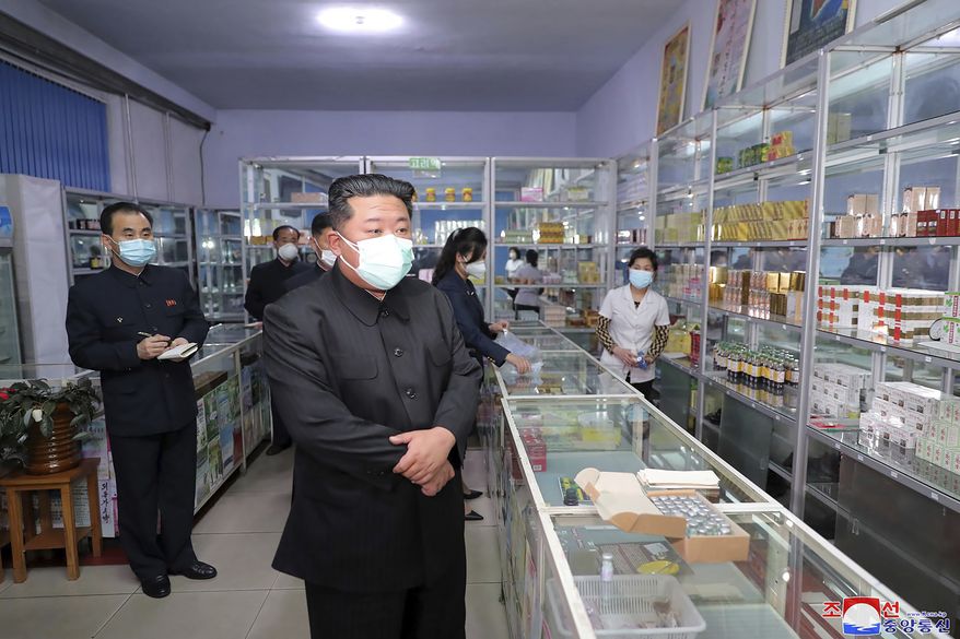 In this photo provided by the North Korean government, North Korean leader Kim Jong-un, center, visits a pharmacy in Pyongyang, North Korea on May 15, 2022. Independent journalists were not given access to cover the event depicted in this image distributed by the North Korean government. The content of this image is as provided and cannot be independently verified. Korean language watermark on image as provided by source reads: &quot;KCNA&quot; which is the abbreviation for Korean Central News Agency. (Korean Central News Agency/Korea News Service via AP, File)