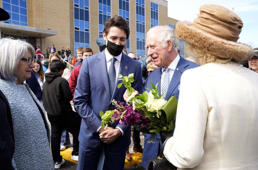 Prince Charles and Camilla, Duchess of Cornwall greet Canada&#39;s Gov.-Gen. Mary Simon as Prime Minister Justin Trudeau looks on, in St. John&#39;s, during the start a three-day Royal Canadian tour, Tuesday, May 17, 2022.  (Paul Chiasson/The Canadian Press via AP)