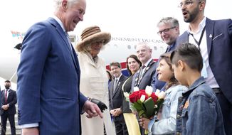 Prince Charles and Camilla, Duchess of Cornwall, arrive in St. John&#39;s to begin a three-day Canadian tour, Tuesday, May 17, 2022.  (Paul Chiasson/The Canadian Press via AP)