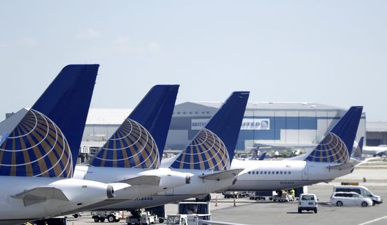 FILE - In this July 18, 2018, file photo, United Airlines commercial jets sit at a gate at Terminal C of Newark Liberty International Airport in Newark, N.J. Federal safety regulators have approved steps that will let United Airlines resume using dozens of Boeing 777 jets that have been grounded since the engine on one plane blew apart over Denver last year. The Federal Aviation Administration on Tuesday, May 17, 2022, confirmed that it has approved steps necessary for flights to resume using the planes, which have engines made by Pratt &amp;amp; Whitney.  (AP Photo/Julio Cortez, File)