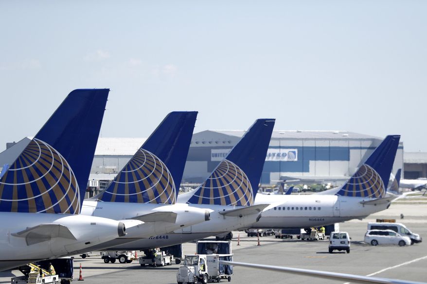 FILE - In this July 18, 2018, file photo, United Airlines commercial jets sit at a gate at Terminal C of Newark Liberty International Airport in Newark, N.J. Federal safety regulators have approved steps that will let United Airlines resume using dozens of Boeing 777 jets that have been grounded since the engine on one plane blew apart over Denver last year. The Federal Aviation Administration on Tuesday, May 17, 2022, confirmed that it has approved steps necessary for flights to resume using the planes, which have engines made by Pratt &amp;amp; Whitney.  (AP Photo/Julio Cortez, File)