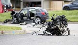 FILE - The scene of a fatality car crash, June 2, 2021, in Tulsa, Okla.  Nearly 43,000 people were killed on U.S. roads last year, the highest number in 16 years as Americans returned to the highways after the pandemic forced many to stay at home.  The 10.5% jump over 2020 numbers was the largest percentage increase since the National Highway Traffic Safety Administration began its fatality data collection system in 1975. (Tanner Laws/Tulsa World via AP, File)