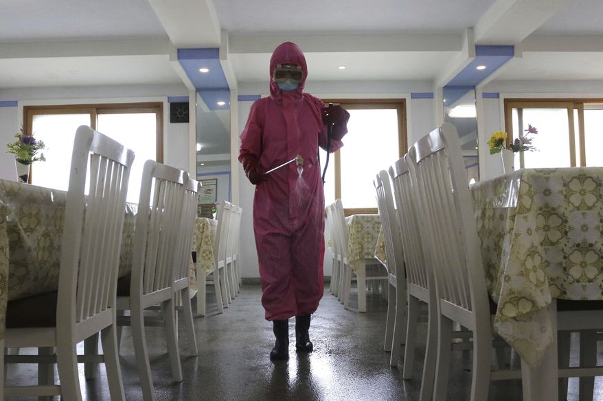 An employee of Pyongyang Dental Hygiene Products Factory disinfects the floor of a dining room as the state increased measures to stop the spread of illness in Pyongyang, North Korea on May 16, 2022. North Korea on Wednesday, May 18, reported 232,880 new cases of fever and another six deaths as leader Kim Jong-un accused officials of “immaturity” and “slackness” in handling the escalating COVID-19 outbreak ravaging across the unvaccinated nation. (AP Photo/Cha Song Ho, File)